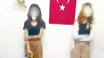 Çikolata çalan kız çocuklarının Türk bayrağının önünde fotoğrafını çekip sosyal medyada afişe etti