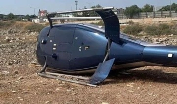 Son dakika... İzmir'de bir helikopter kalkış esnasında yan yattı